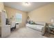 Inviting bedroom with a daybed, desk, and neutral color palette at 2170 Trelipe Dr, Lawrenceville, GA 30044