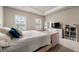 Bright bedroom with neutral walls, plush carpet, and tray ceiling at 2170 Trelipe Dr, Lawrenceville, GA 30044