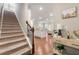 Entryway with staircase and an open floor plan leading to the kitchen and living areas at 2170 Trelipe Dr, Lawrenceville, GA 30044