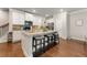 Spacious kitchen with an island, granite countertops, stainless steel appliances, and hardwood floors at 2170 Trelipe Dr, Lawrenceville, GA 30044