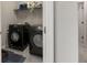 Convenient laundry room with modern, dark-colored appliances at 2170 Trelipe Dr, Lawrenceville, GA 30044