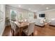 Open-concept living and dining area with hardwood floors and large windows at 2170 Trelipe Dr, Lawrenceville, GA 30044