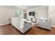 Cozy living room with modern furniture, hardwood floors, and large window at 2170 Trelipe Dr, Lawrenceville, GA 30044