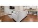 Open-concept living room and kitchen area with hardwood floors and modern decor at 2170 Trelipe Dr, Lawrenceville, GA 30044