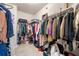 Spacious walk-in closet with ample storage space and clothing racks at 2170 Trelipe Dr, Lawrenceville, GA 30044