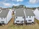 Aerial view of backyards with patios, showcasing a community of modern homes at 1393 Halpern Nw Ln, Kennesaw, GA 30144