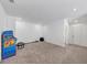 Spacious basement featuring workout equipment and an arcade game at 1393 Halpern Nw Ln, Kennesaw, GA 30144