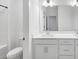 Well-lit bathroom featuring double sink vanity and bathtub with shower at 1393 Halpern Nw Ln, Kennesaw, GA 30144