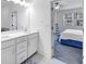 Contemporary bathroom with double vanity and views of the bedroom at 1393 Halpern Nw Ln, Kennesaw, GA 30144