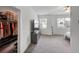 Spacious bedroom with carpeted floors, a walk-in closet, and natural light from multiple windows at 1393 Halpern Nw Ln, Kennesaw, GA 30144