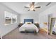 Inviting bedroom with a large window, soft carpet, a plush bed, and a calming color scheme at 1393 Halpern Nw Ln, Kennesaw, GA 30144