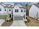 Charming two-story home with white siding, gray roof, attached garage, and well-kept lawn at 1393 Halpern Nw Ln, Kennesaw, GA 30144