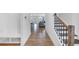 Open foyer with hardwood floors, staircase, and easy access to the main living areas at 1393 Halpern Nw Ln, Kennesaw, GA 30144
