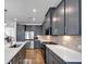 Stylish kitchen featuring gray cabinets, stainless steel appliances, white countertops, and a tiled backsplash at 1393 Halpern Nw Ln, Kennesaw, GA 30144