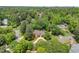 Stunning aerial view of a brick home nestled among lush trees in a serene, wooded neighborhood at 194 Sentinel Se Pl, Marietta, GA 30067