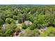 A high angle reveals the circular driveway, lush trees, and mature landscaping on this property at 194 Sentinel Se Pl, Marietta, GA 30067
