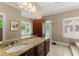 The bathroom features a granite countertop, large mirror, walk in tub, and shuttered window at 194 Sentinel Se Pl, Marietta, GA 30067
