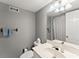 Clean bathroom featuring a single sink vanity, tile, and a neutral color scheme at 194 Sentinel Se Pl, Marietta, GA 30067