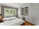 Cozy bedroom with two beds, built-in cabinets and drawers, plus a window at 194 Sentinel Se Pl, Marietta, GA 30067