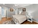 Comfortable bedroom with a queen bed, hardwood floors, and serene atmosphere at 194 Sentinel Se Pl, Marietta, GA 30067