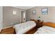 Inviting bedroom with two beds, hardwood floors, and calming decor at 194 Sentinel Se Pl, Marietta, GA 30067