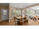 Bright dining area with natural wood table, bench, and large windows for outdoor views at 194 Sentinel Se Pl, Marietta, GA 30067