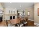 Dining area with bar, open to a kitchen, and view to the living room at 194 Sentinel Se Pl, Marietta, GA 30067