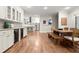 Spacious dining area featuring a dark wood table and a view of the modern kitchen at 194 Sentinel Se Pl, Marietta, GA 30067