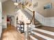 Elegant foyer with hardwood floors, staircase, and decorative accents at 194 Sentinel Se Pl, Marietta, GA 30067