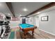 Recreational area featuring a pool table, exposed beams and exercise equipment at 194 Sentinel Se Pl, Marietta, GA 30067