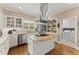 Spacious kitchen has an island cooktop, stainless appliances, and built-in storage at 194 Sentinel Se Pl, Marietta, GA 30067