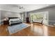 This main bedroom features hardwood floors, large windows, and cozy sitting area at 194 Sentinel Se Pl, Marietta, GA 30067