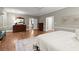 Bright main bedroom features a ceiling fan, hardwood floors, neutral paint, and ensuite access at 194 Sentinel Se Pl, Marietta, GA 30067