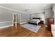 Large main bedroom suite boasts neutral walls, hardwood floors, and ample space at 194 Sentinel Se Pl, Marietta, GA 30067