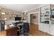 Spacious home office with custom built-ins, hardwood floors, and natural light at 194 Sentinel Se Pl, Marietta, GA 30067