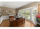 Bright office space with a large wooden desk, built-in bookshelves and bay windows with views of backyard at 194 Sentinel Se Pl, Marietta, GA 30067