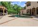 An in-ground pool, tanning ledge, spa, and well-maintained landscaping are just steps from the back of this home at 194 Sentinel Se Pl, Marietta, GA 30067