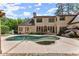 A backyard pool is complemented by a tanning ledge, an outdoor fireplace, multiple seating and dining areas at 194 Sentinel Se Pl, Marietta, GA 30067