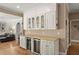 Stylish wet bar features custom cabinetry, granite countertops, and wine refrigerators at 194 Sentinel Se Pl, Marietta, GA 30067