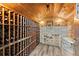 Rustic wine cellar with wooden racks and a stone accent wall at 194 Sentinel Se Pl, Marietta, GA 30067