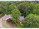 Aerial view of home with manicured lawn, surrounded by lush trees, offering privacy and a beautiful landscape at 2622 Murdock Rd, Marietta, GA 30062
