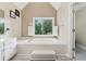 Bright bathroom with a soaking tub situated under a large window at 2622 Murdock Rd, Marietta, GA 30062