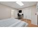 Well-lit bedroom featuring desk, TV, closet and comfortable furniture at 2622 Murdock Rd, Marietta, GA 30062