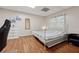 Cozy bedroom with hardwood floors, comfortable bed, and natural light at 2622 Murdock Rd, Marietta, GA 30062
