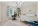 This bedroom has an attached desk, and a view of the outdoors at 2622 Murdock Rd, Marietta, GA 30062