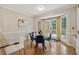 Cozy breakfast nook with natural lighting and a glass table with four chairs at 2622 Murdock Rd, Marietta, GA 30062
