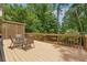 Spacious wooden deck with seating area surrounded by lush trees and beautiful landscape at 2622 Murdock Rd, Marietta, GA 30062