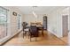Bright dining room offers hardwood floors and modern lighting with a view of the landscaped yard at 2622 Murdock Rd, Marietta, GA 30062