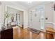 Bright entryway with hardwood floors, white door, and view into the living room at 2622 Murdock Rd, Marietta, GA 30062