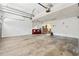 Spacious garage with concrete floor, storage, and overhead doors at 2622 Murdock Rd, Marietta, GA 30062